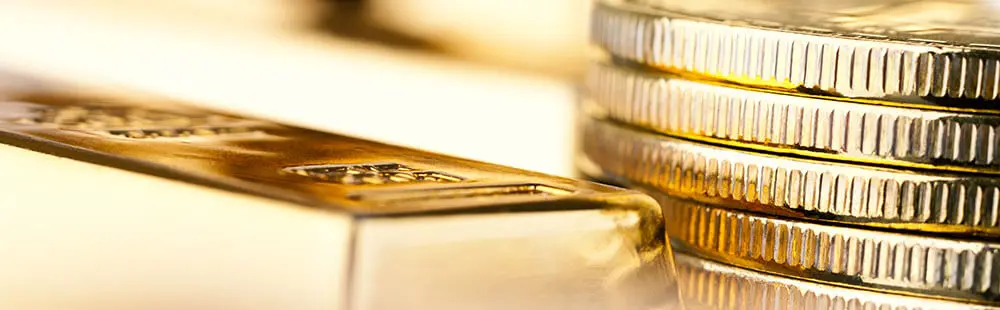 What Is a Precious Metals IRA? Illustration showing gold and silver coins and bars in an IRA context